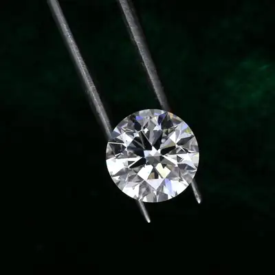 Fortune Gems: sparkling diamond held by tweezers