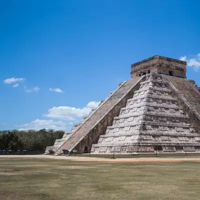 Golden Empire: ancient stepped pyramid under blue sky