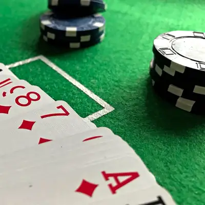 Live Baccarat: playing cards and chips on green felt